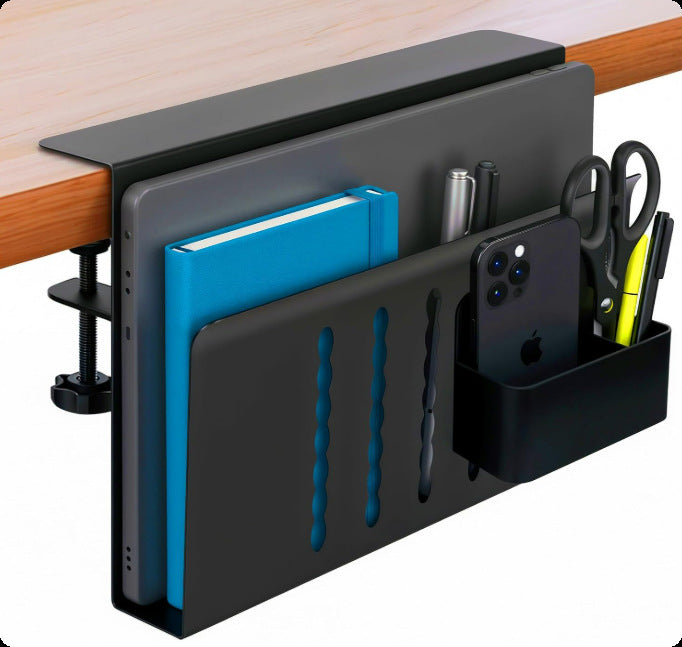 Black clamp holder on a desk edge with a book, phone and pens