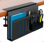 Black clamp holder on a desk edge with a book, phone and pens